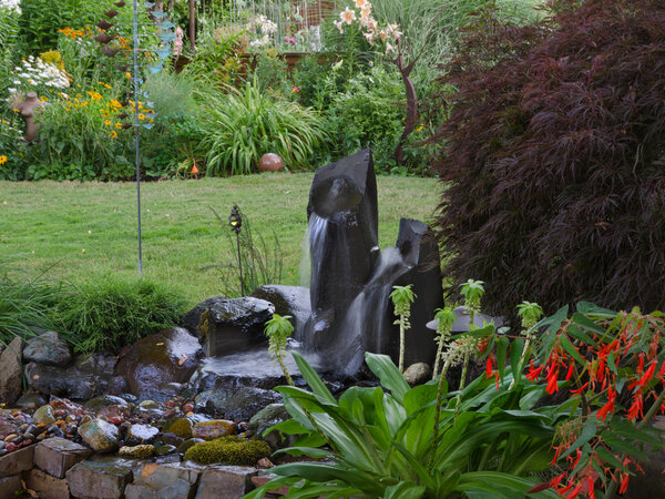 A,Serene,Backyard,Retreat,With,Twin,Fountains,In,The,Foreground