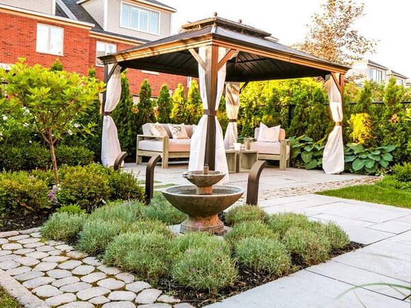 Outdoor Living Space Installation With Paver Walkway And Landscape Design